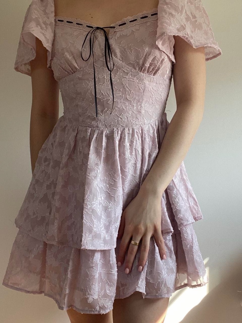 Lush Lace Tiered Puff-Sleeve Mini Dress in Pale Pink with Black Tie